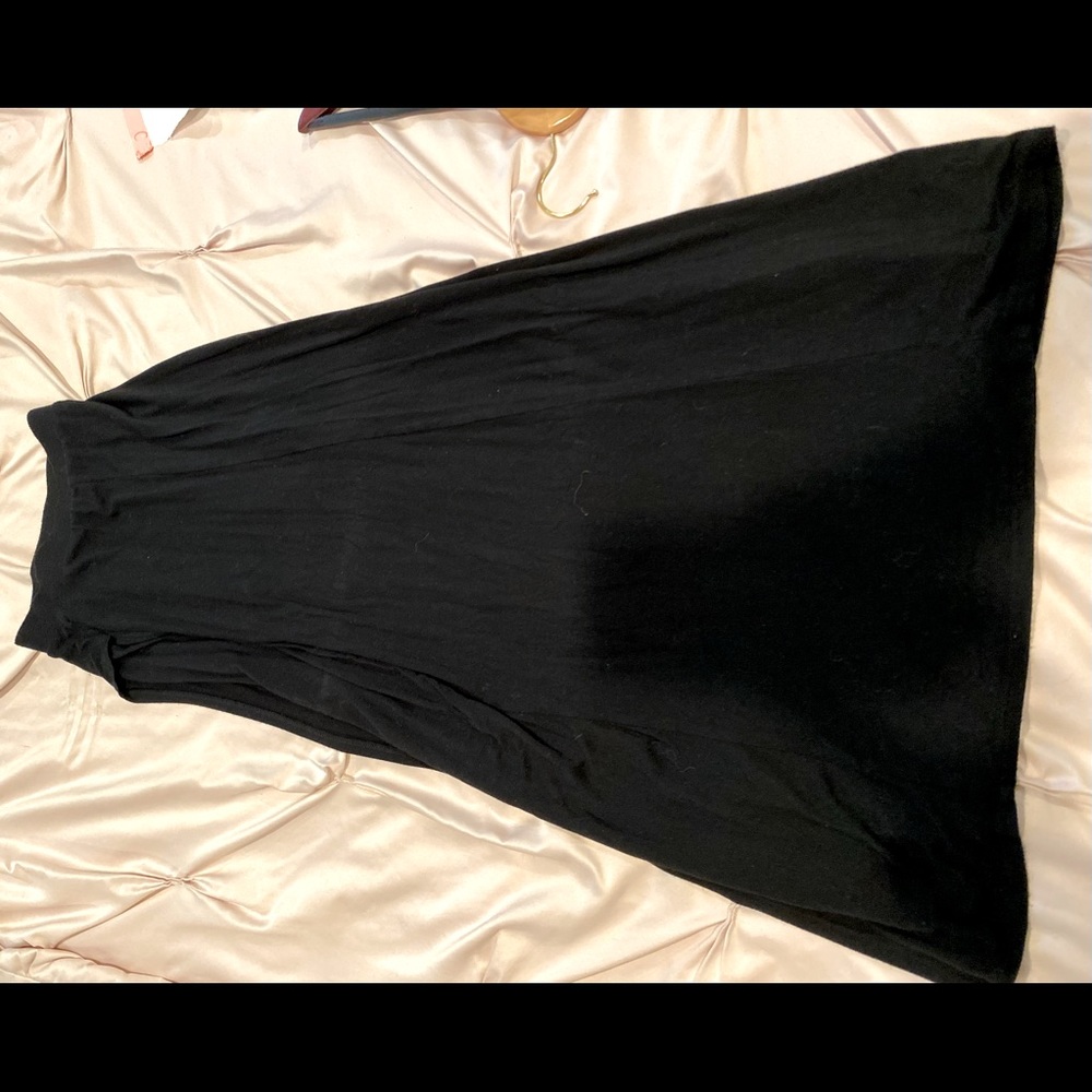 Black ankle length skirt. Lower thigh high slit on the left side. Soft fabric
